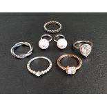 FIVE PANDORA RINGS comprising a Sparkling Teardrop Halo ring, a Sparkling Twisted Lines ring, a Band