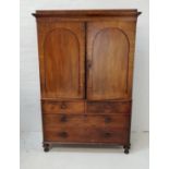 VICTORIAN MAHOGANY PRESS CUPBOARD with a cornice above a pair of arched panelled doors opening to