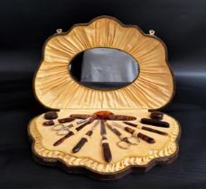 1950s FAUX TORTOISESHELL MANICURE SET in a shell shaped fitted case with an oval mirror to the lid