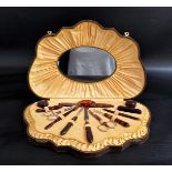 1950s FAUX TORTOISESHELL MANICURE SET in a shell shaped fitted case with an oval mirror to the lid