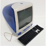 VINTAGE APPLE I MAC COMPUTER model M5521, EMC 1857, with a blue cased body, keyboard, mouse,
