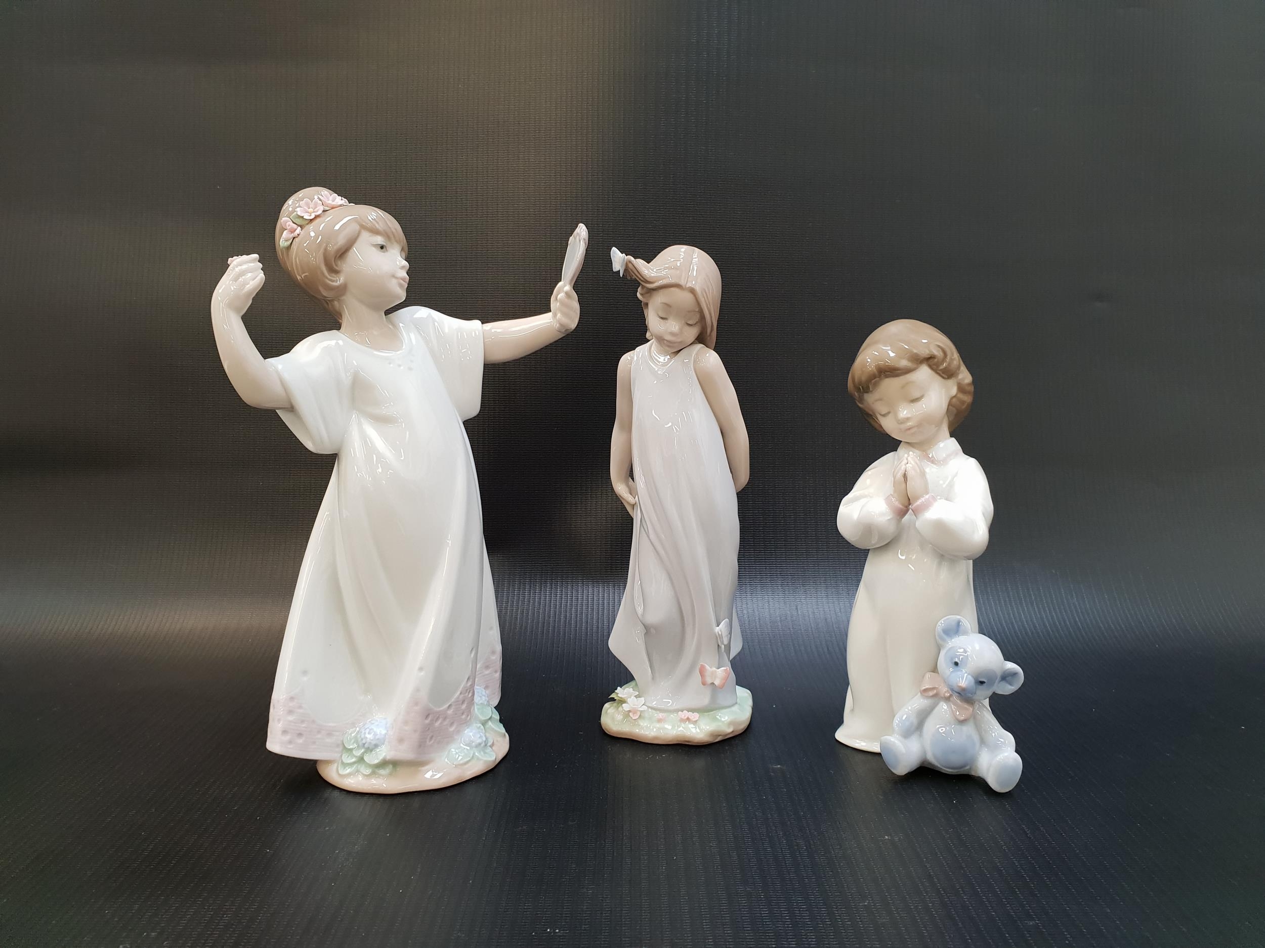 THREE LLADRO FIGURINES comprising Friend of the Butterflies - number 6963; Nightime Blessings -