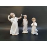 THREE LLADRO FIGURINES comprising Friend of the Butterflies - number 6963; Nightime Blessings -
