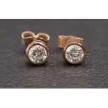 PAIR OF BEZEL SET DIAMOND STUD EARRINGS the diamonds totalling approximately 0.5cts, in nine carat