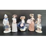 FIVE LLADRO FIGURINES comprising New Shoes - number 6487; Pretty Pickings; a girl with a parcel; a