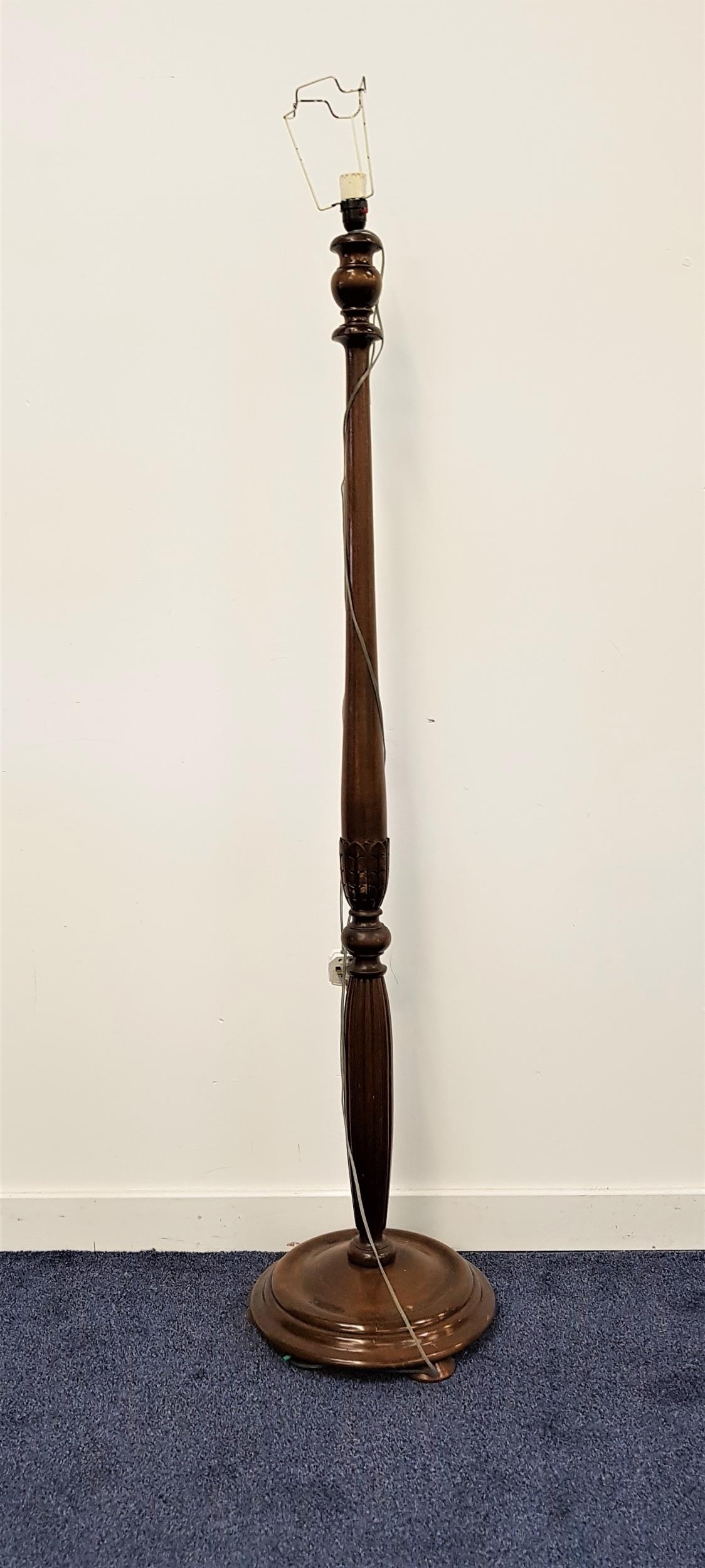 OAK STANDARD LAMP raised on a circular base with a turned and carved column, 159cm high