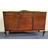 BOW FRONT MAHOGANY SIDEBOARD with a shaped raised back above three central drawers flanked by a pair