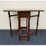 SMALL OAK GATE LEG TABLE with shaped drop flaps, 60.5cm wide