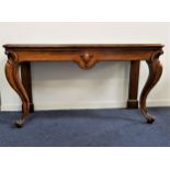 VICTORIAN OAK SERVING TABLE now lacking its raised back, with a moulded top above a central carved