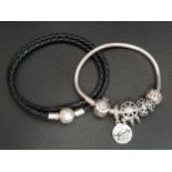 PANDORA MOMENTS CROWN CLASP SNAKE BRACELET with three charms and one clip; together with a Pandora