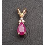 RUBY AND DIAMOND PENDANT the pear cut ruby approximately 0.4cts below three small diamonds, in