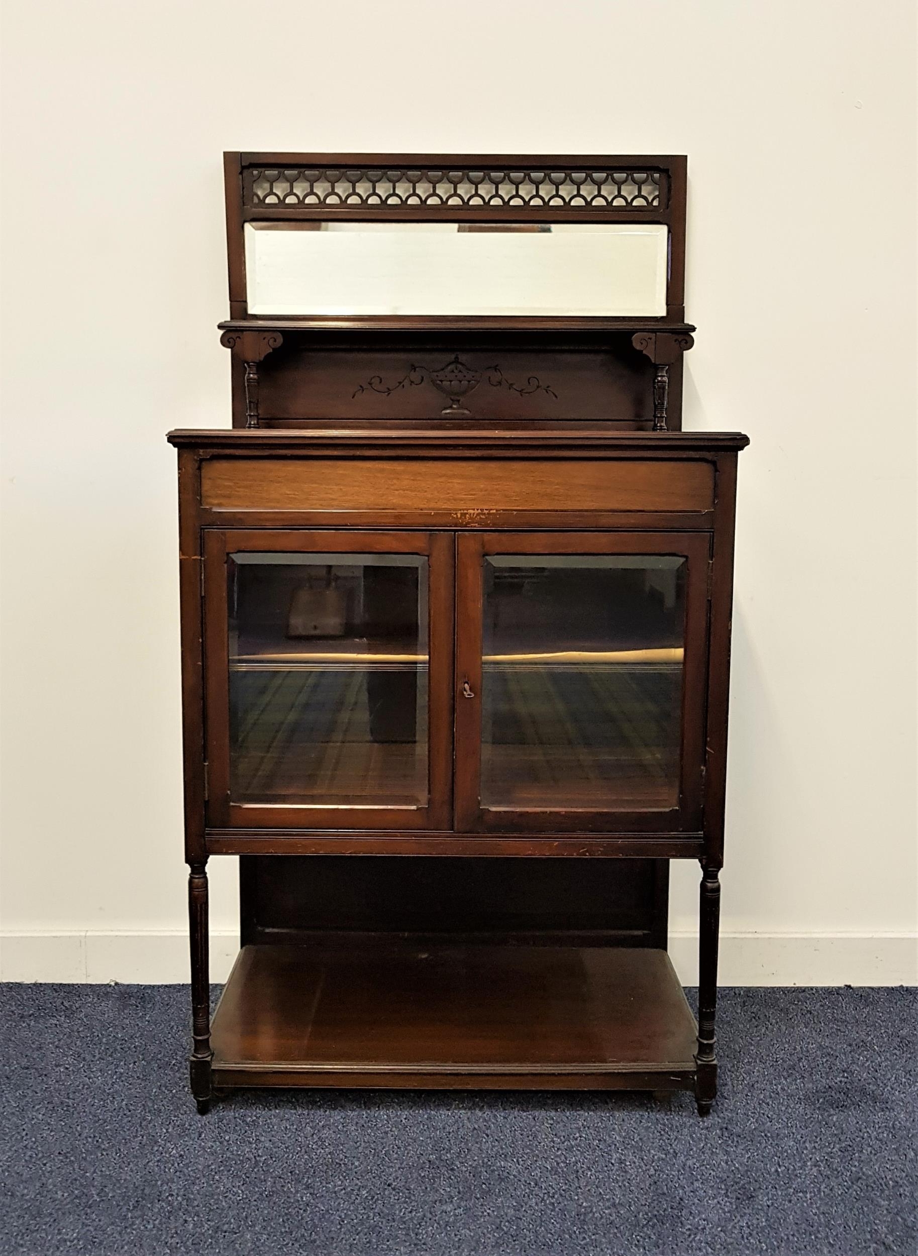 EDWARDIAN TEAK SIDE CABINET with a pierced lattice work frame above a bevelled rectangular mirror