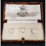 SET OF THREE ENAMEL AND SEED PEARL DRESS STUDS in eighteen carat nine carat gold, in fitted box