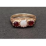 OPAL AND GARNET THREE STONE RING on nine carat gold shank, ring size J and approximately 1.9 grams
