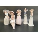 THREE LLADRO FIGURINES AND TWO BELLS the figures comprising a Lladro Utopia figure of a seated