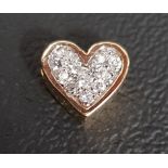 PAVE SET DIAMOND HEART SHAPED PENDANT in fourteen carat gold, 0.9cm wide
