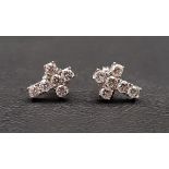 PAIR OF DIAMOND CROSS SHAPED STUD EARRINGS the diamonds totalling approximately 0.7cts (0.35cts