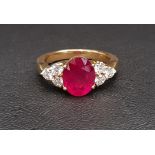 IMPRESSIVE TREATED RUBY AND DIAMOND DRESS RING the large central ruby measuring approximately 12.1mm