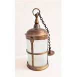 CIRCULAR BRASS HALL LANTERN with opaque glass and a suspension chain, 81cm high