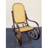 BENTWOOD ROCKING CHAIR with a shaped caned back and seat