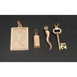 FOUR NINE CARAT GOLD PENDANTS/CHARMS comprising a Scorpio pendant, a gold bar, a key with the number