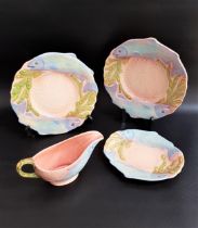 H. WAIN & SONS MELBA WARE POTTERY FISH SERVICE with a salmon pink ground decorated with salmon,