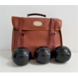 SET OF FOUR THOMAS TAYLOR LAWN BOWLS with lignoid Tru-Grip, size 5, in a carry case, together with