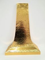 HAMMERED BRASS CHIMNEY PIECE of shaped tapering form, 115cm x 81cm