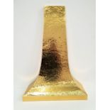 HAMMERED BRASS CHIMNEY PIECE of shaped tapering form, 115cm x 81cm