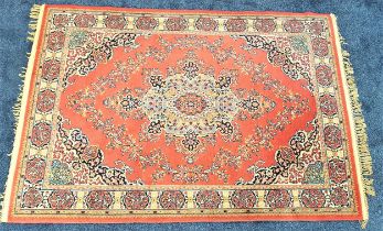 LANSDOWNE WILTON PERSIAN RUG with a claret ground and a central medallion encased by a decorative