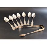 SEVEN VICTORIAN SILVER TEA SPOONS in the Kings pattern and a matching pair of sugar tongs, Glasgow
