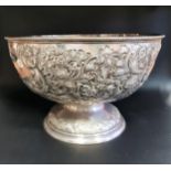 VICTORIAN SILVER ROSE BOWL with elobrate embossed decoration, raised on a circular foot, monogrammed