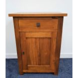TEAK SIDE CABINET with a plain rectangular top above a frieze drawer with a panelled cupboard door