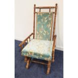 EDWARDIAN MAHOGANY ROCKING CHAIR with a central padded back and loose seat cushion