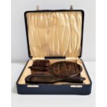 FAUX TORTOISESHELL DRESSING TABLE SET in a fitted box, comprising a hair brush, hand mirror and soap