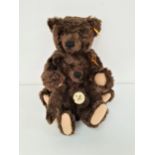 TWO STEIFF CLASSIC SERIES 1920 REPLICA TEDDY BEARS in brown mohair, the smaller example with paper