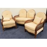 WALNUT AND FIGURED WALNUT THREE PIECE SUITE comprising a two seat sofa with a double arched and