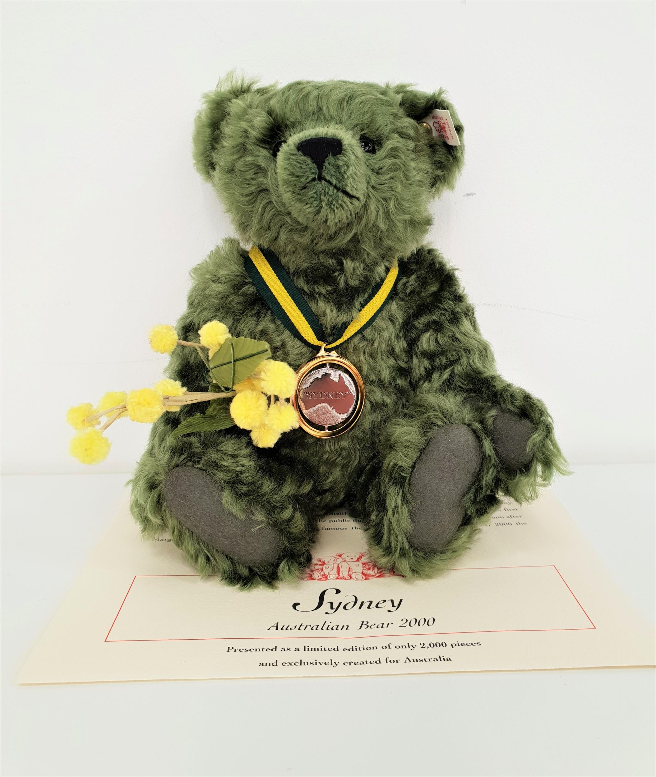 LIMITED EDITION STEIFF SYDNEY AUSTRALIAN BEAR in green mohair and carrying a branch of 'Wattle'