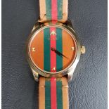 GENTLEMAN'S GUCCI G-TIMELESS WRISTWATCH the dial and strap with green and red stripe detail, the