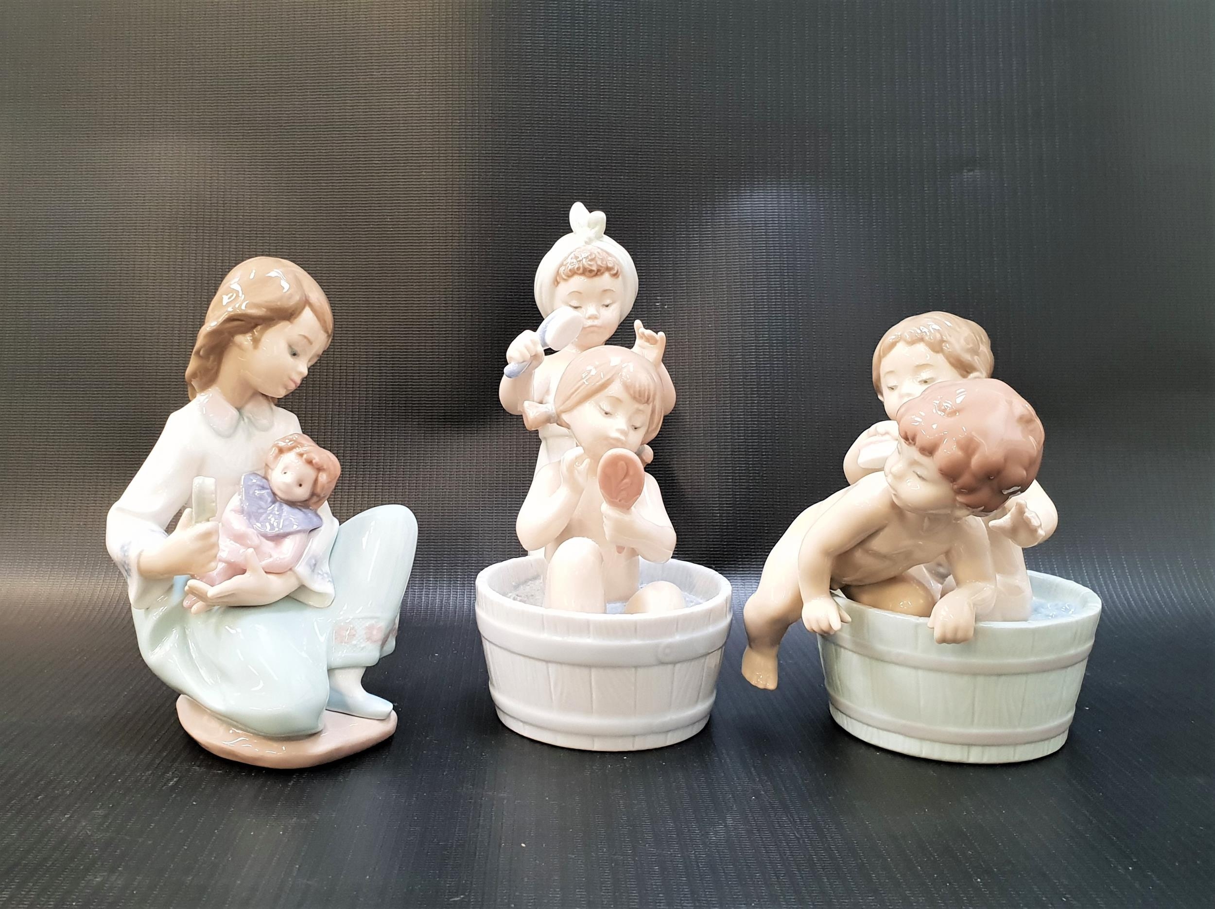 THREE LLADRO FIGURINES comprising Bathing Beauties - number 6457; Bath Time - number 6411; and