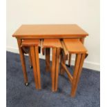 RETRO TEAK OCCASIONAL TABLE with a rectangular top on tapering supports with casters, 57cm high,