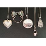 SELECTION OF SILVER JEWELLERY including circular silver locket pendant, three further silver