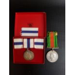QUEEN ELIZABETH II SILVER JUBILEE MEDAL boxed with a spare ribbon, together with The Defence Medal