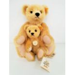 TWO STEIFF CLASSIC SERIES 1909 TEDDY BEARS both in angora mohair plush, the larger example with