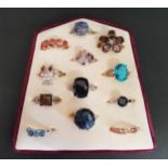 GOOD SELECTION OF TWELVE SILVER RINGS of various designs including topaz and other gemstones,