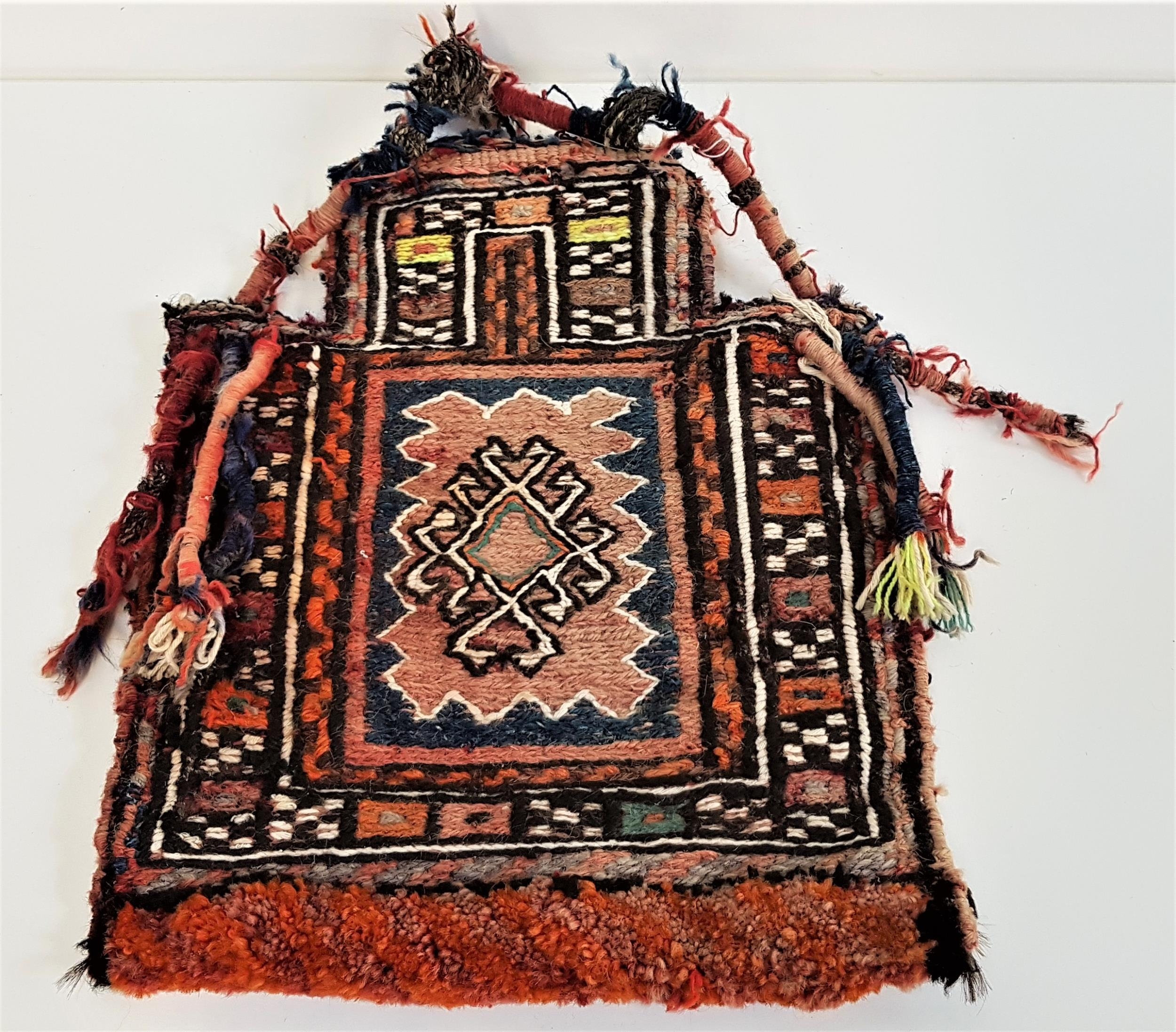 CAUCASUS REGION TRIBAL SALT BAG with tassle decoration and carry handle, 45cm high