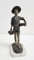 AFTER GIOVANNI DE MARTINO a spelter figure of a boy carrying fish in a basket, on a shaped alabaster