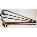 SIX VINTAGE WALKING STICKS three with silver collars, ranging in height from 78.5cm to 94.5cm (6)