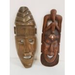 CARVED AFRICAN WALL MASK in teak with pierced detail and inset bone decoration, 44.5cm high,