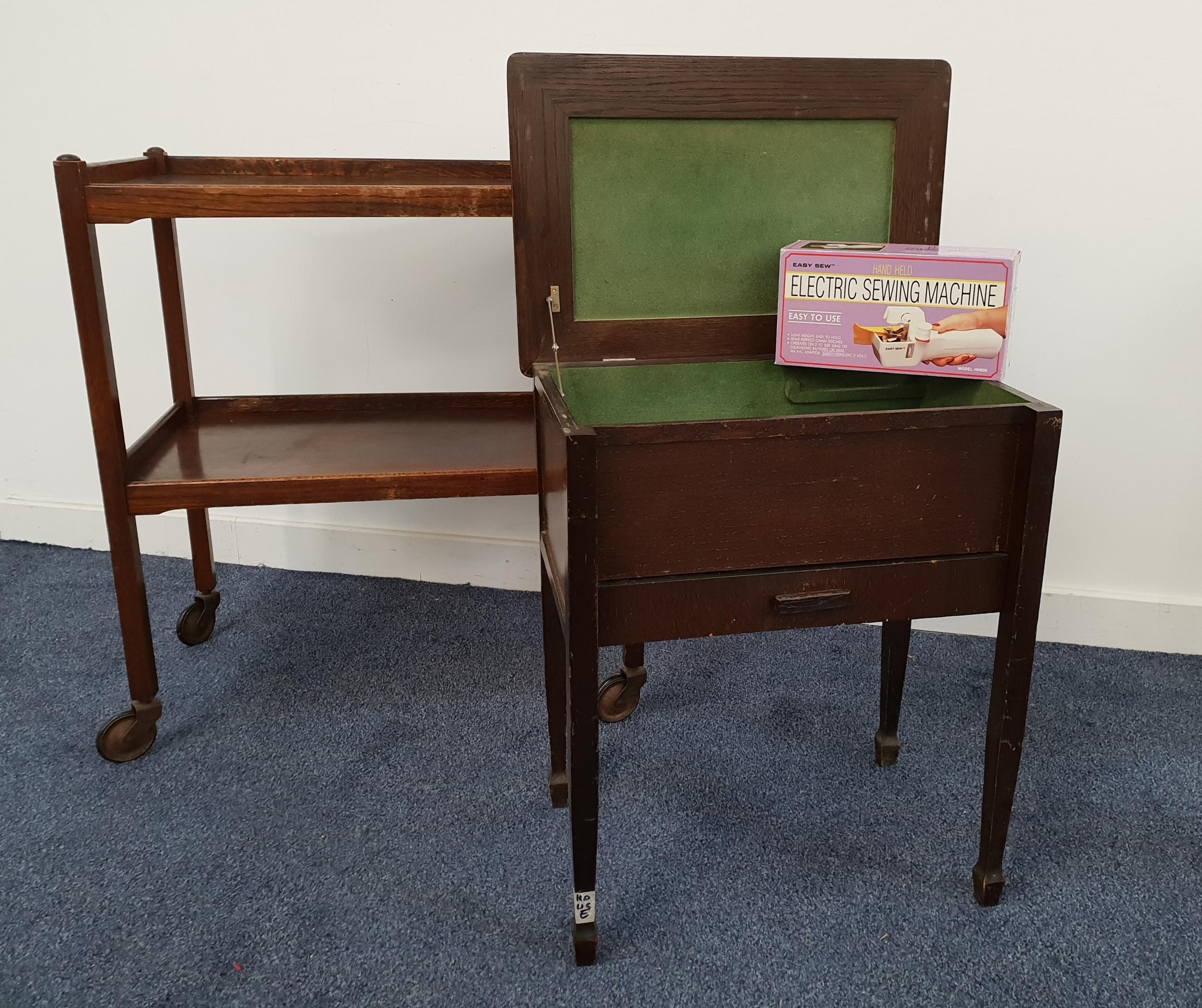 OAK TEA TROLLEY with a three quarter galleried top and a shelf below, on casters, 78cm high,